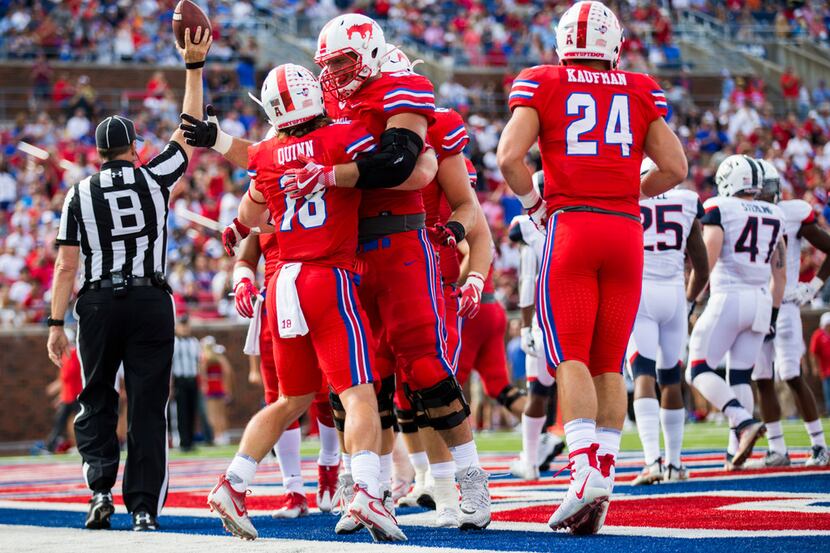 Southern Methodist Mustangs wide receiver Trey Quinn (18) celebrates with team mates after a...