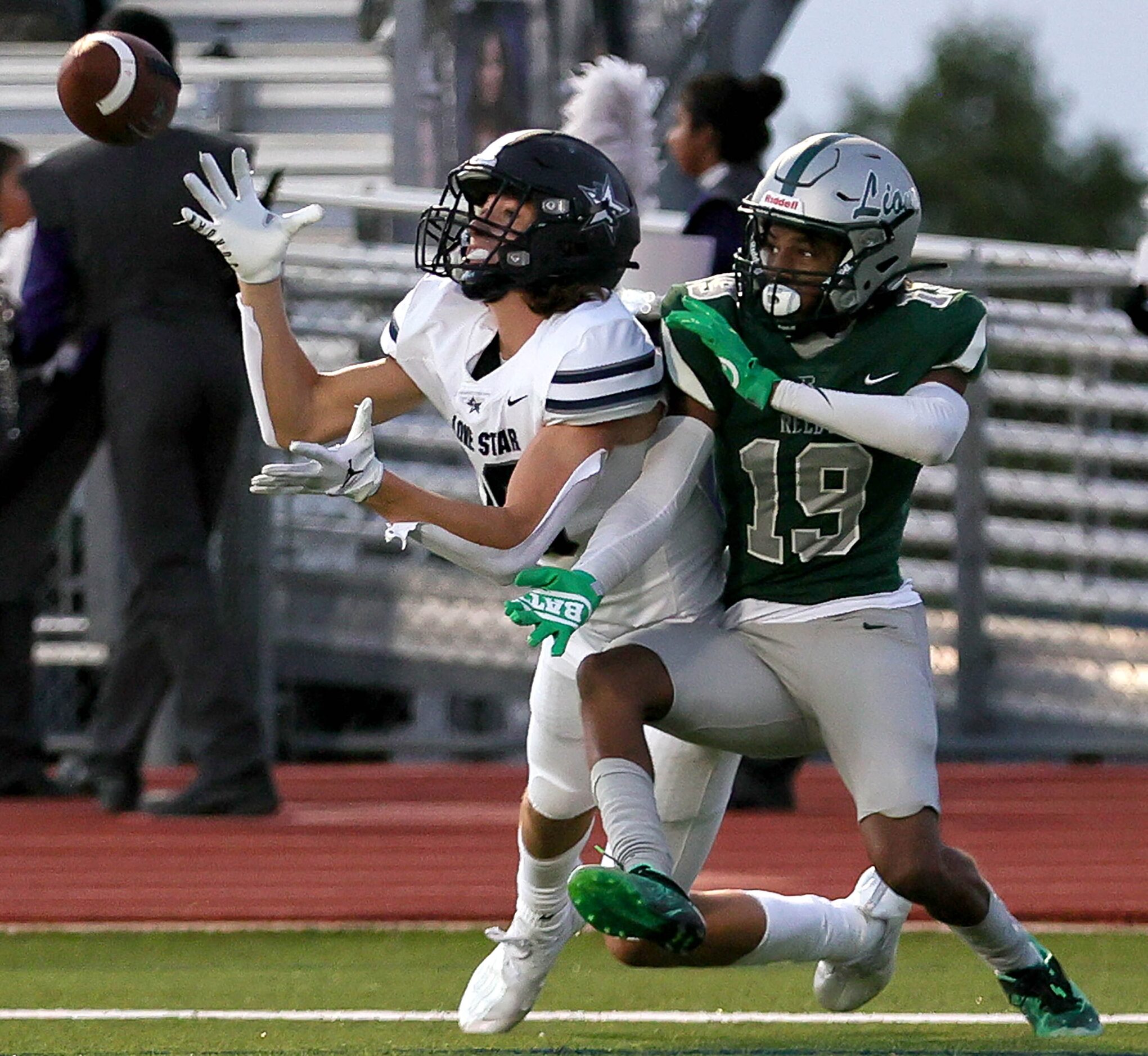 Frisco Lone Star wide receiver Chris Viveros (L) tries to come up with a reception against...