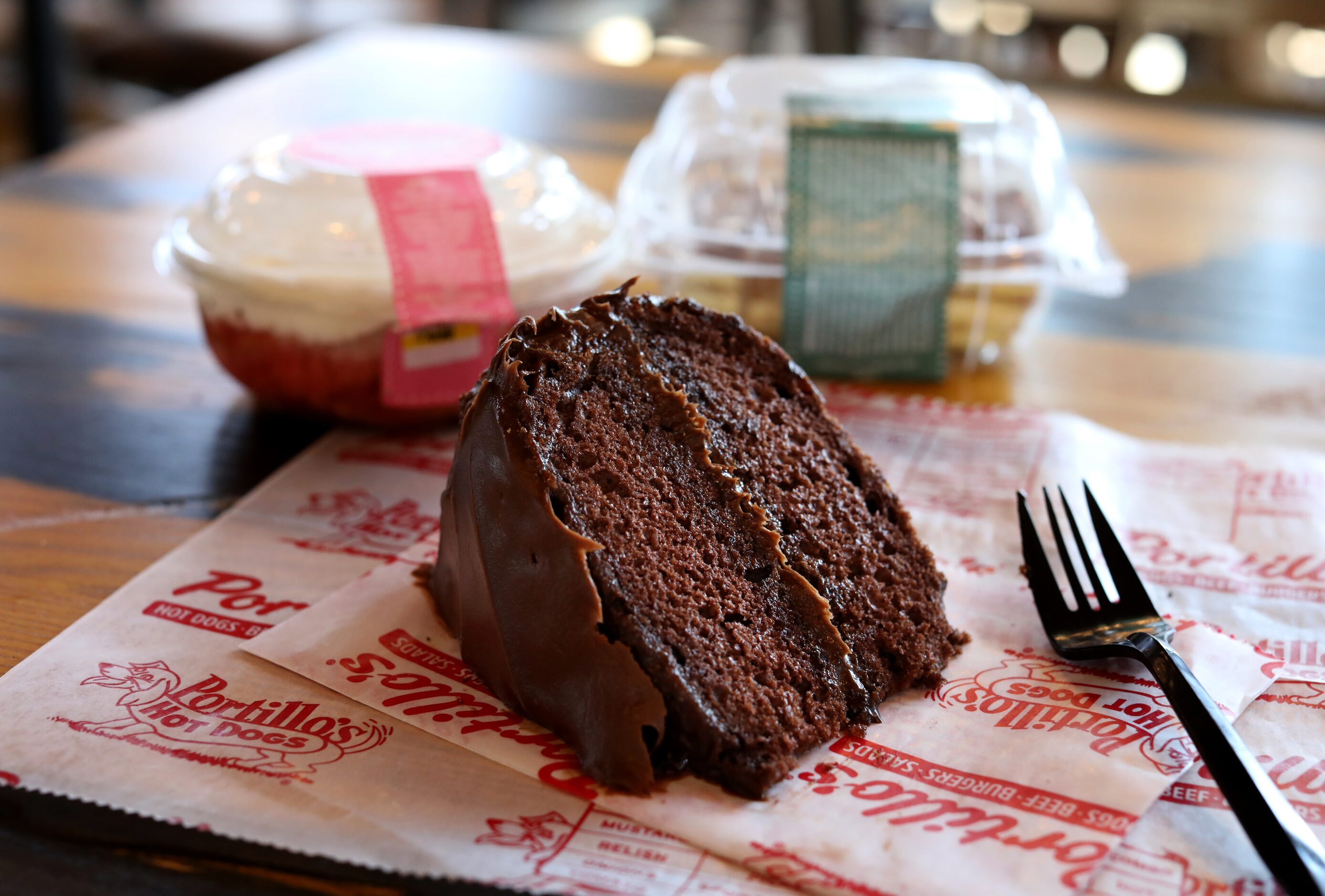 The Strawberry Shortcake, left, Famous Chocolate Cake, and Chocolate Eclair Cake are served...