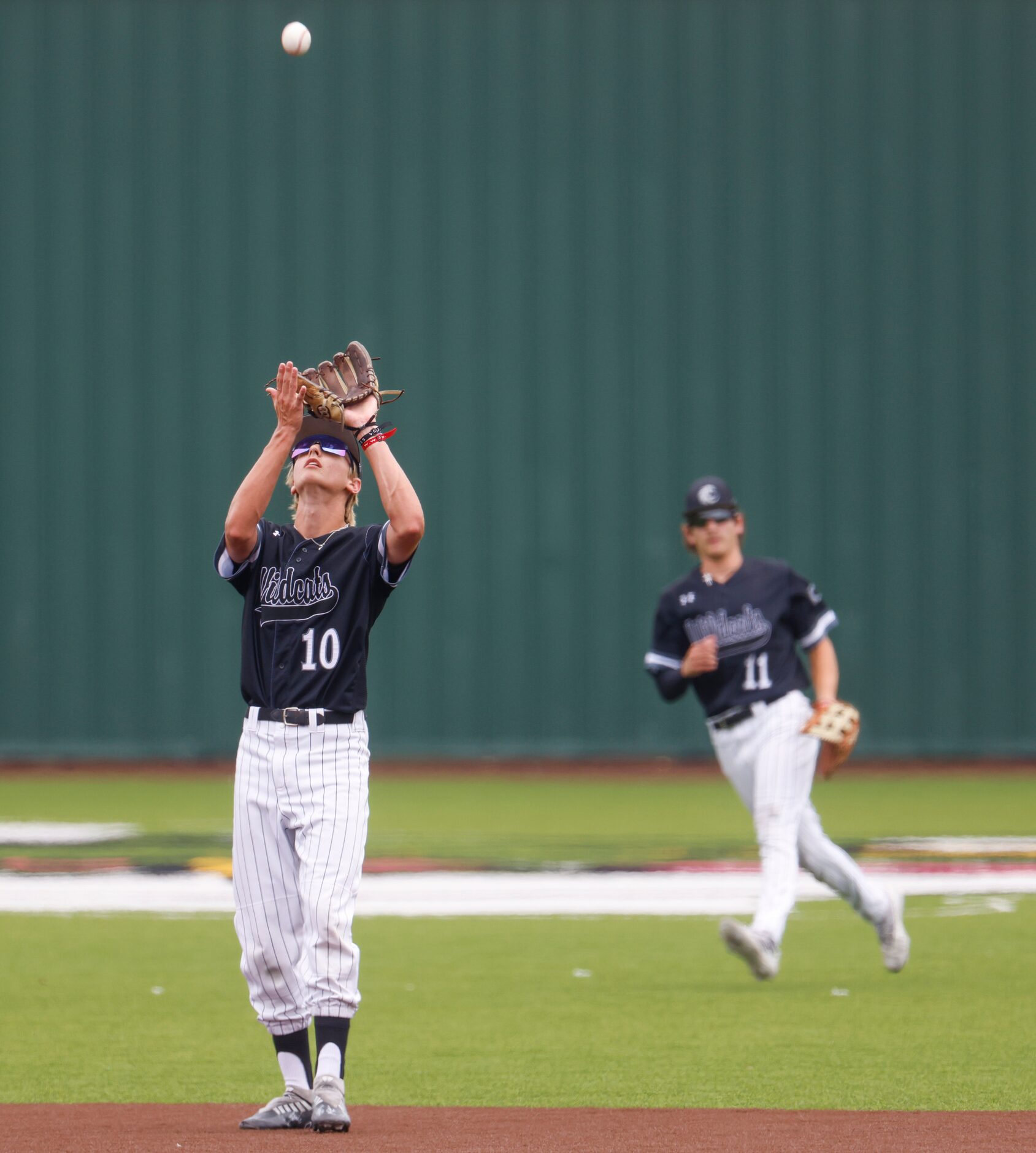 Denton Guyer’s Hunter Gural catches during the third inning of a baseball game against Byron...