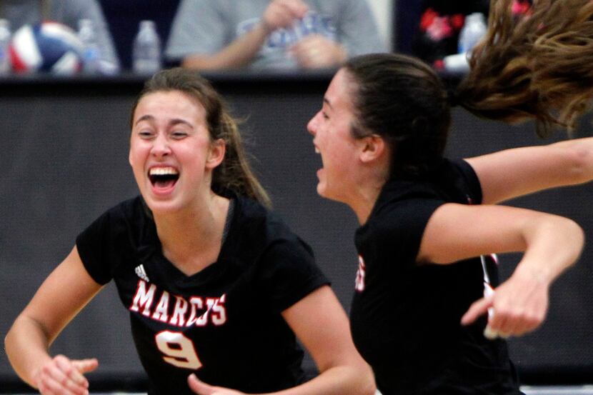 Flower Mound Marcus' Maggie Cox (left) reacts along with teammate Rachel Sturton after Cox...