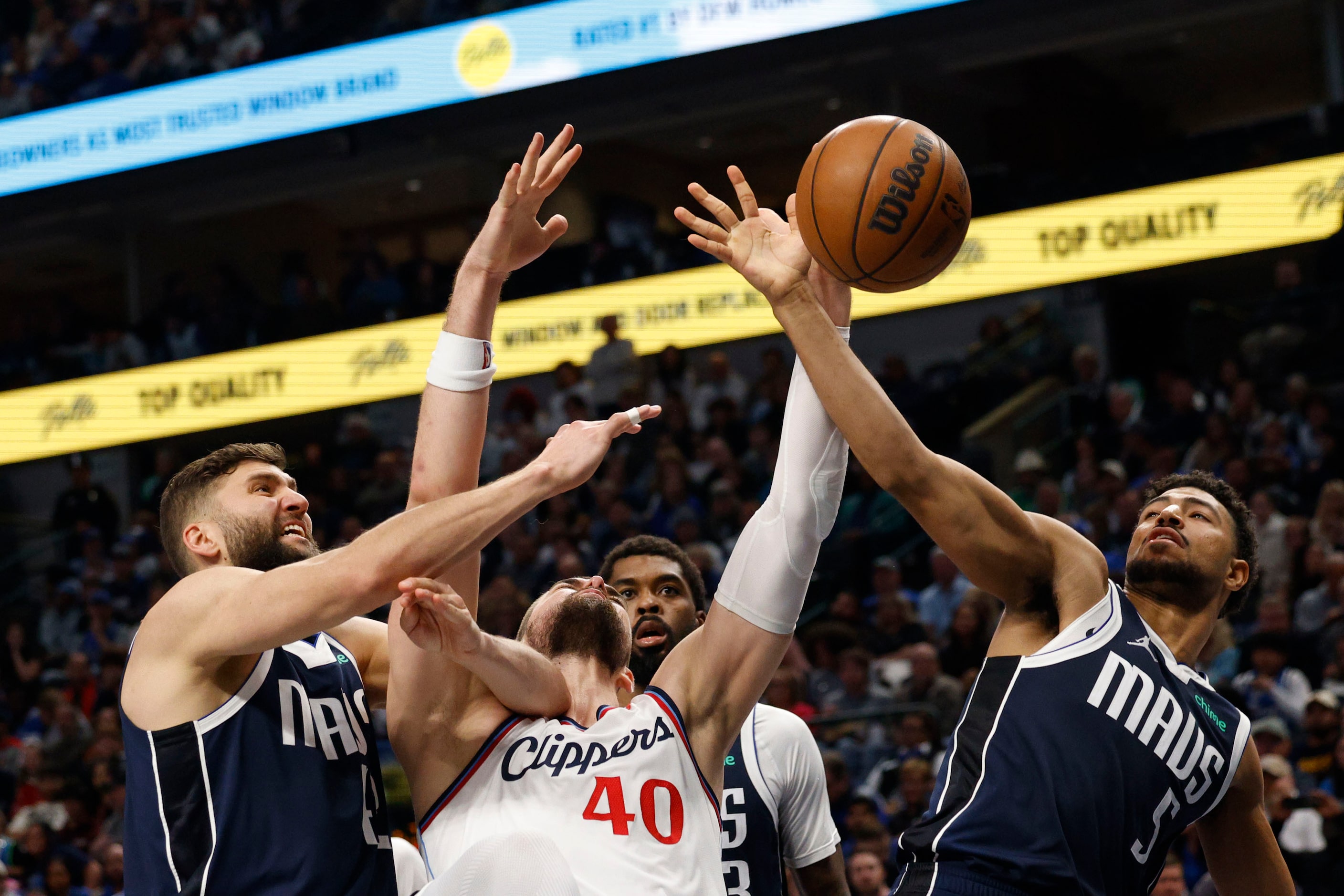 Dallas Mavericks forward Maxi Kleber (42), left, LA Clippers center Ivica Zubac (40) and...