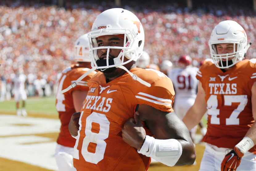 Texas Longhorns quarterback Tyrone Swoopes (18) celebrates after he scored a 3-yard rushing...