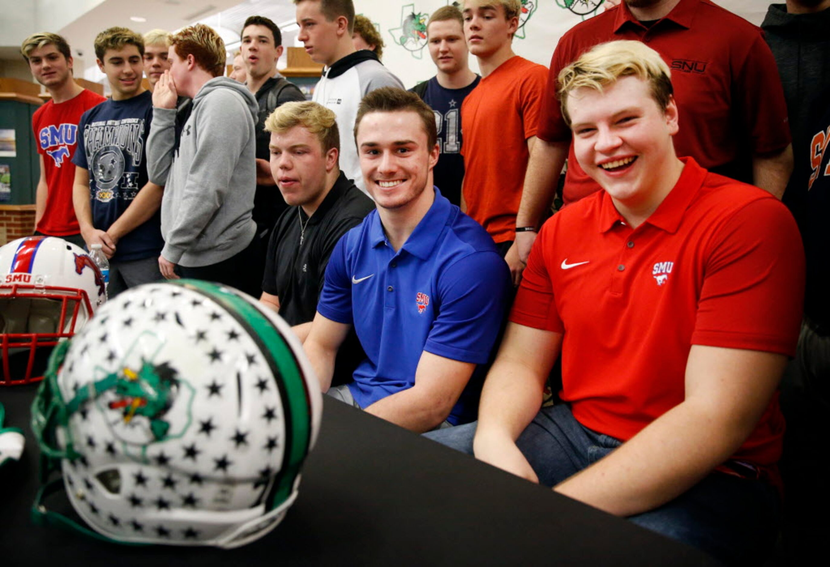 Southlake Carroll running back T.J. McDaniel (second from right) and offensive lineman Henry...