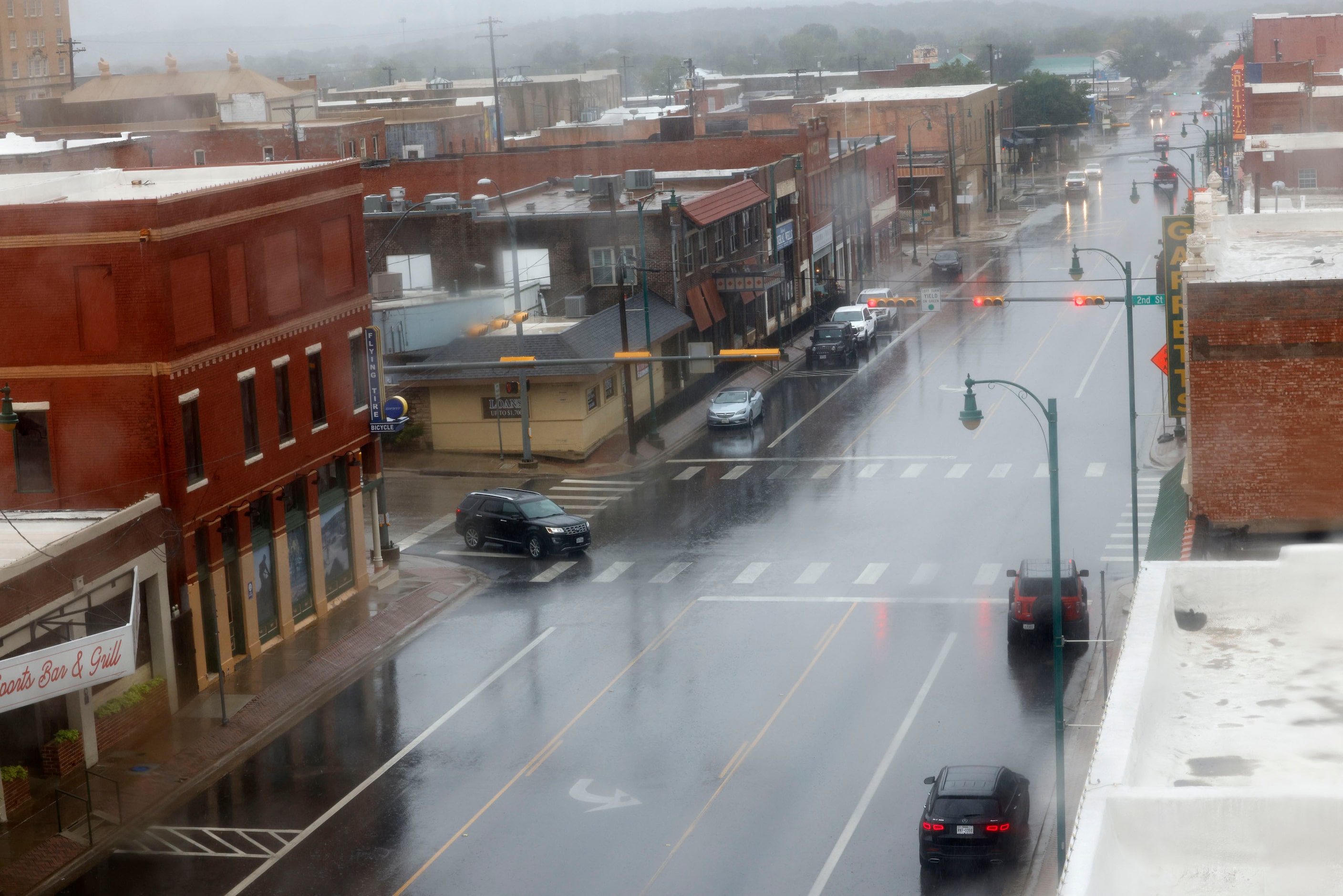 Oak Avenue is seen on a rainy day through a window of The Crazy Water Hotel in Mineral Wells. 