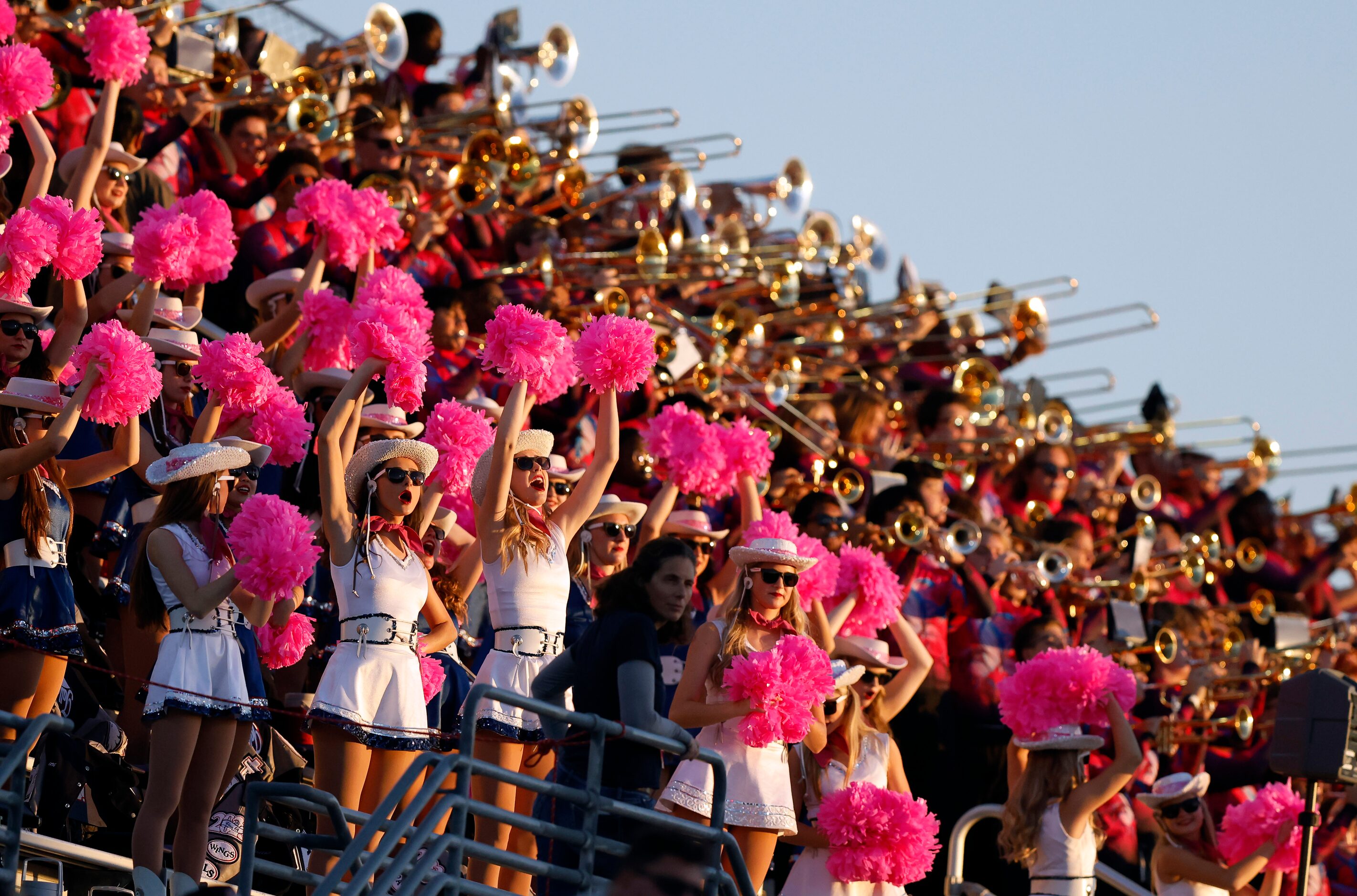 The Allen drill team and marching band cheer their team on as they face Denton Guyer at C.H....