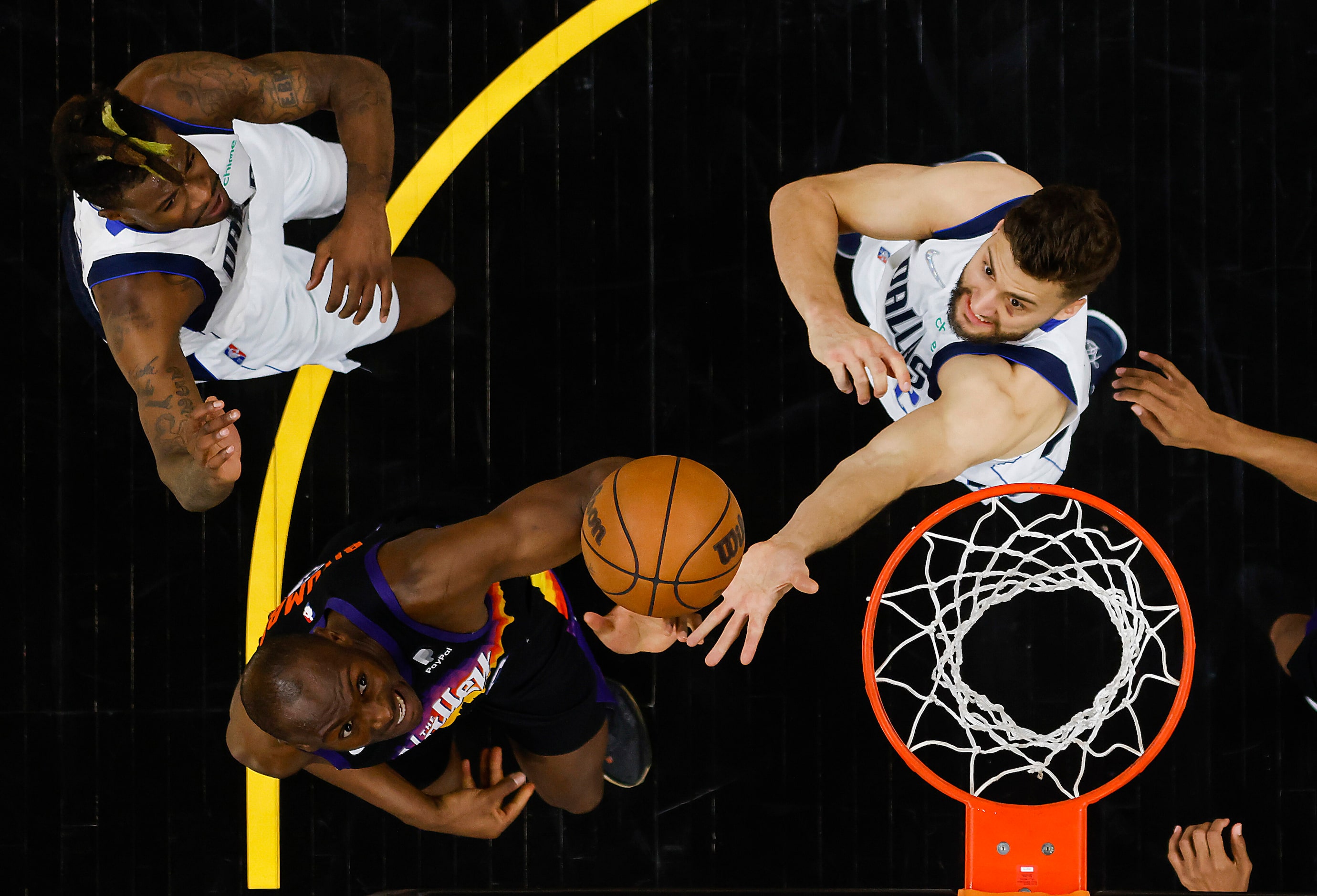 Dallas Mavericks forward Maxi Kleber (42) fights for a rebound against Phoenix Suns center...