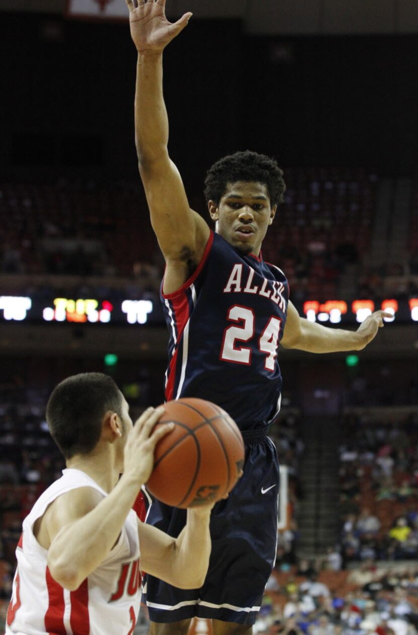 Allen guard Nick Rutherford (24) tries to defend Converse Judson guard Julian Erickson (15)...