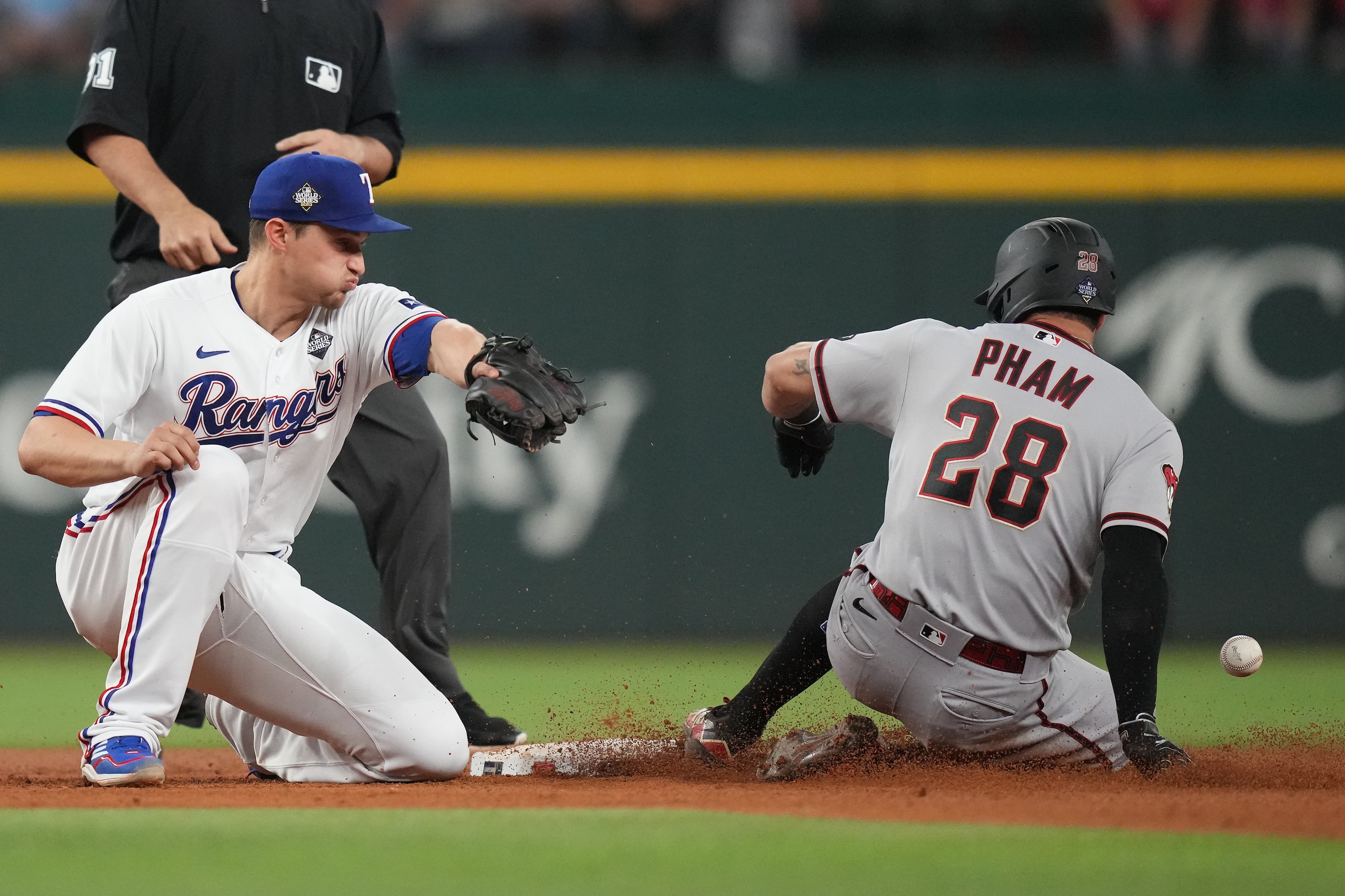 Arizona Diamondbacks designated hitter Tommy Pham (28) slides into second base with a double...