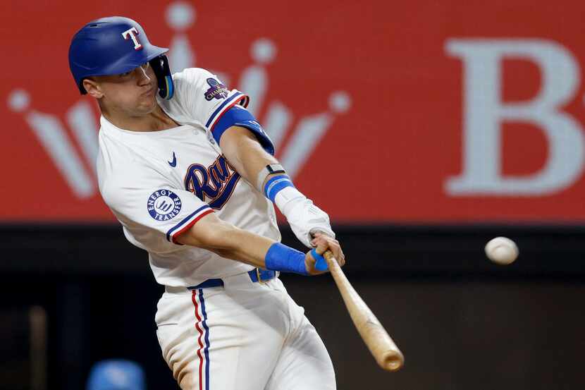 Texas Rangers third baseman Josh Jung (6) hits a two-run home run during the eighth inning...