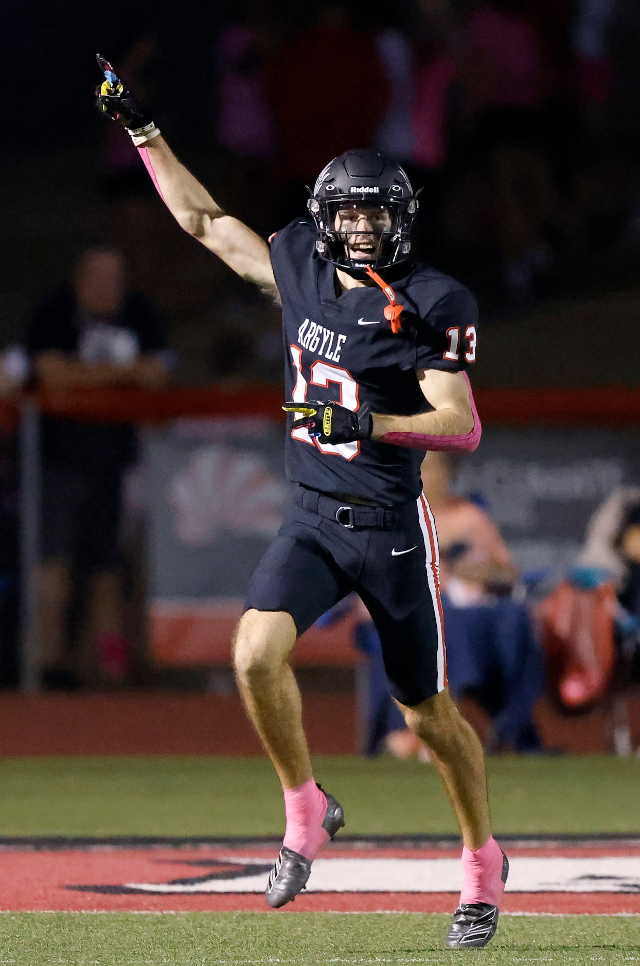 Argyle receiver Will Krzysiak (13) celebrates his long pass reception which he ran in for a...