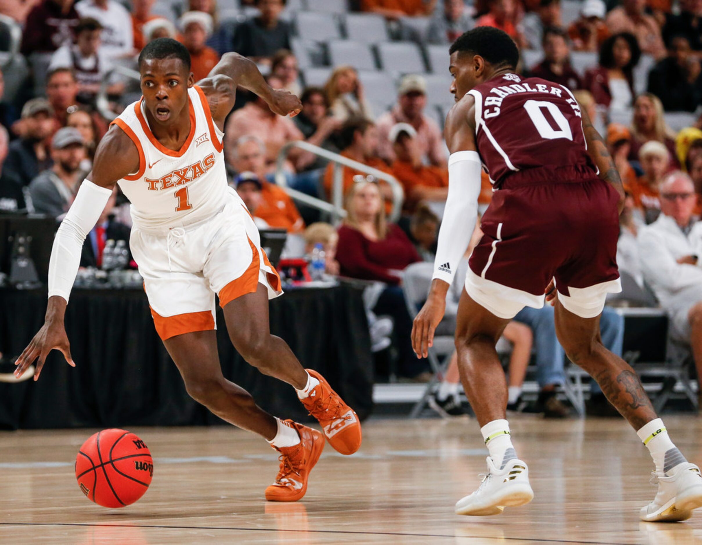 Texas Longhorns guard Andrew Jones (1) drives past Texas A&M Aggies guard Jay Jay Chandler...