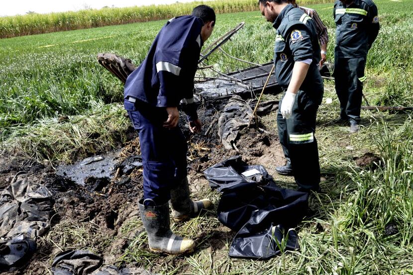 Egyptian rescue workers collected remains in February 2013 at the scene of a balloon crash...