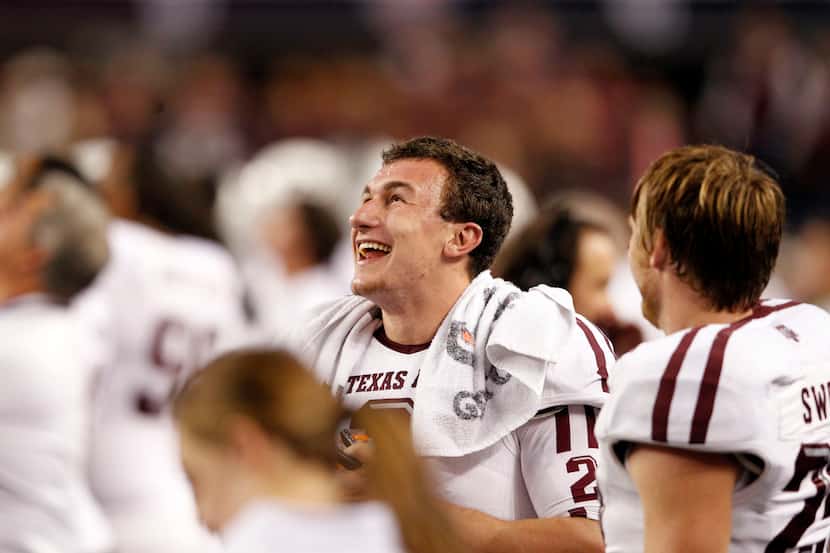 Texas AM Aggies quarterback Johnny Manziel celebrates on the sidelines after yet another...