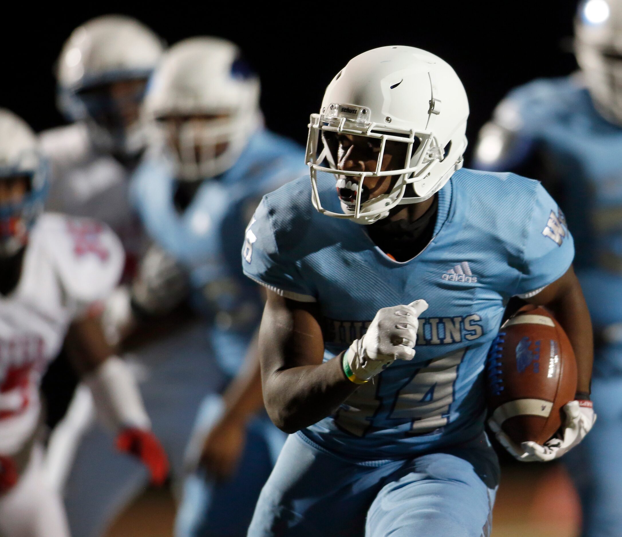 Wilmer Hutchins running back Billy Monroe, lll (44), maneuvers his way into the end zone for...