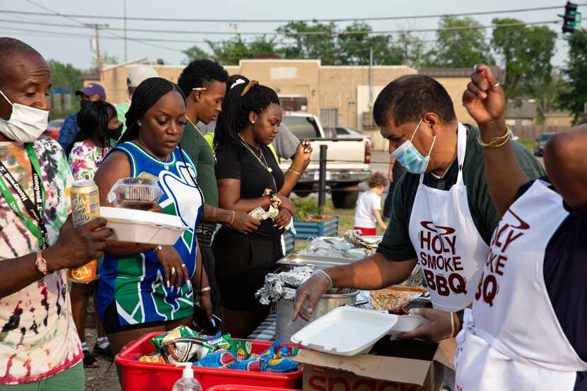 Visitors were able to choose from a variety of food vendors, such as Holy Smoke BBQ, at the...