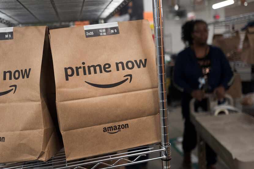 In this Dec. 20, 2017, photo, Prime Now customer orders are ready for delivery at the Amazon...