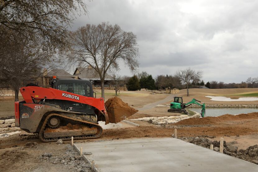Workers prepare for the Byron Nelson tournament at TPC Craig Ranch in McKinney on Mar. 9,...