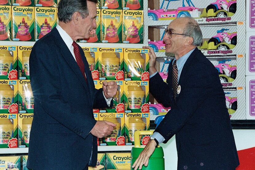 In this Jan. 7, 1992, file photo, President George H. Bush, left, listens to Toys R Us...