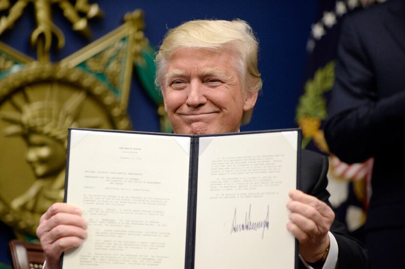 US President Donald Trump signs Executive Orders in the Hall of Heroes at the Department of...