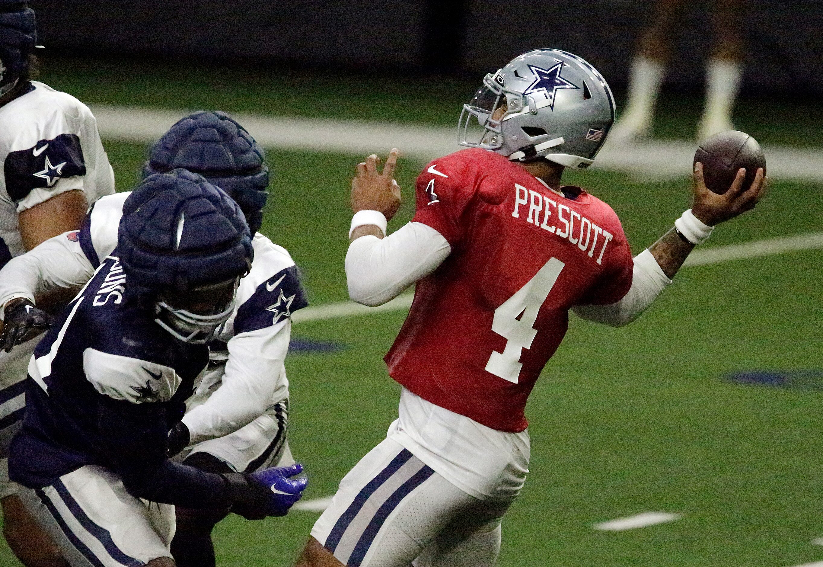 Dallas Cowboys quarterback Dak Prescott (4) throws a pass as the Dallas Cowboys held...