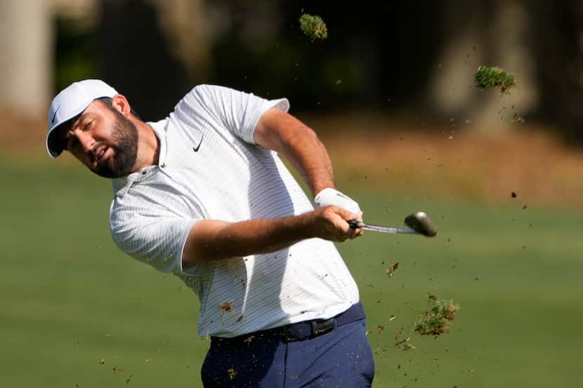 Scottie Scheffler hits from the fairway on the first hole during the first round of the RBC...