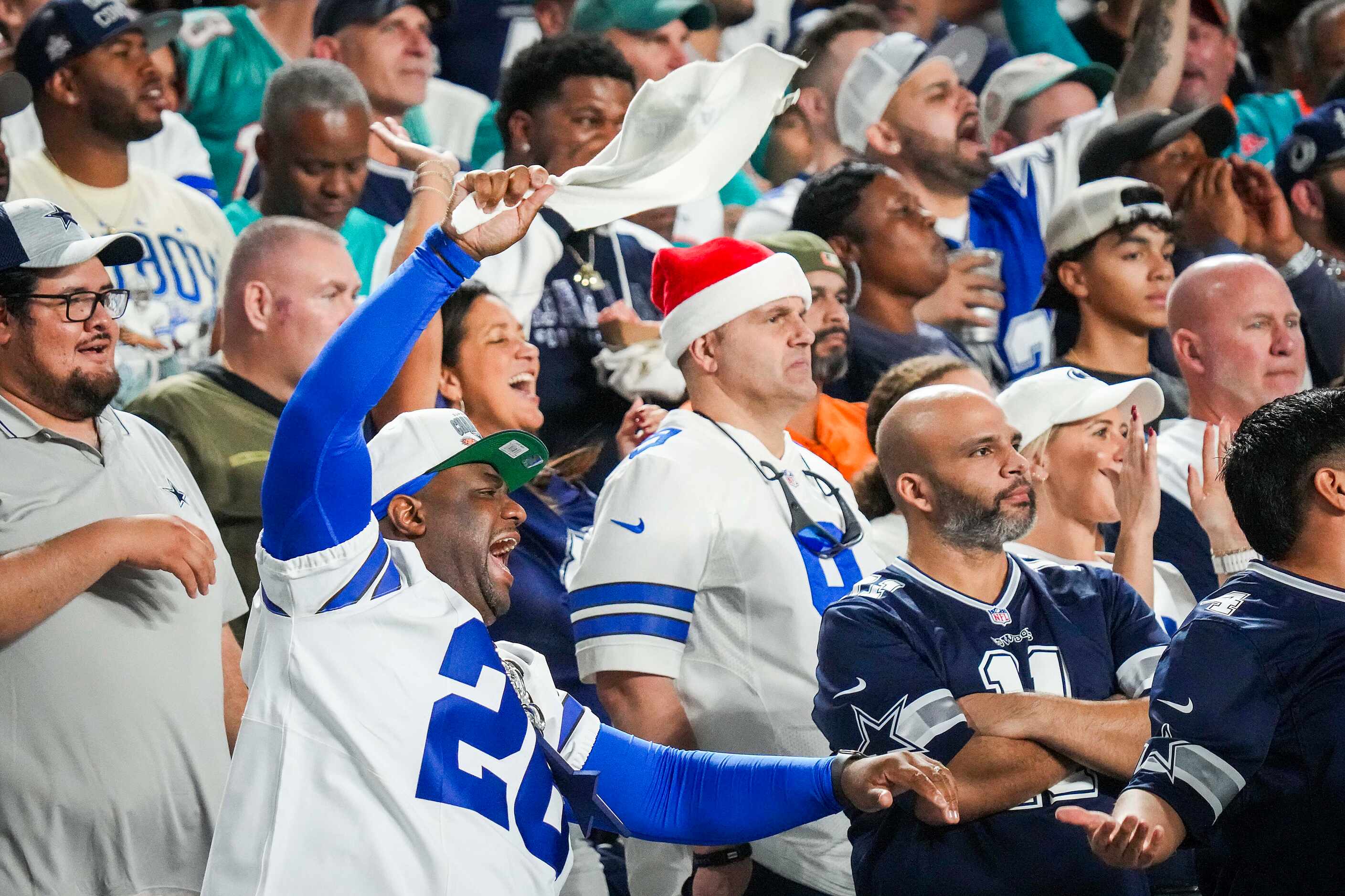 Dallas Cowboys fans cheer on their defenst during the second half of an NFL football game...