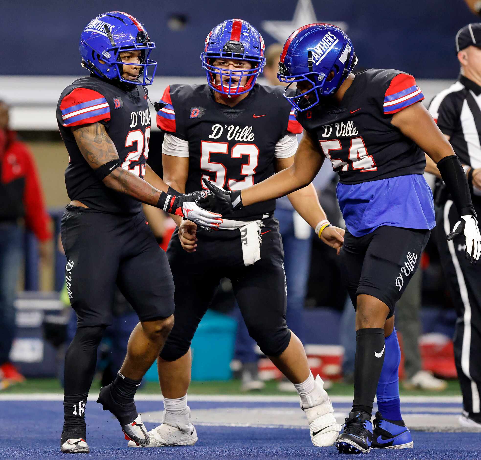 Duncanville’s Jerry Scales (54) congratulates running back Caden Durham (29) on his first...