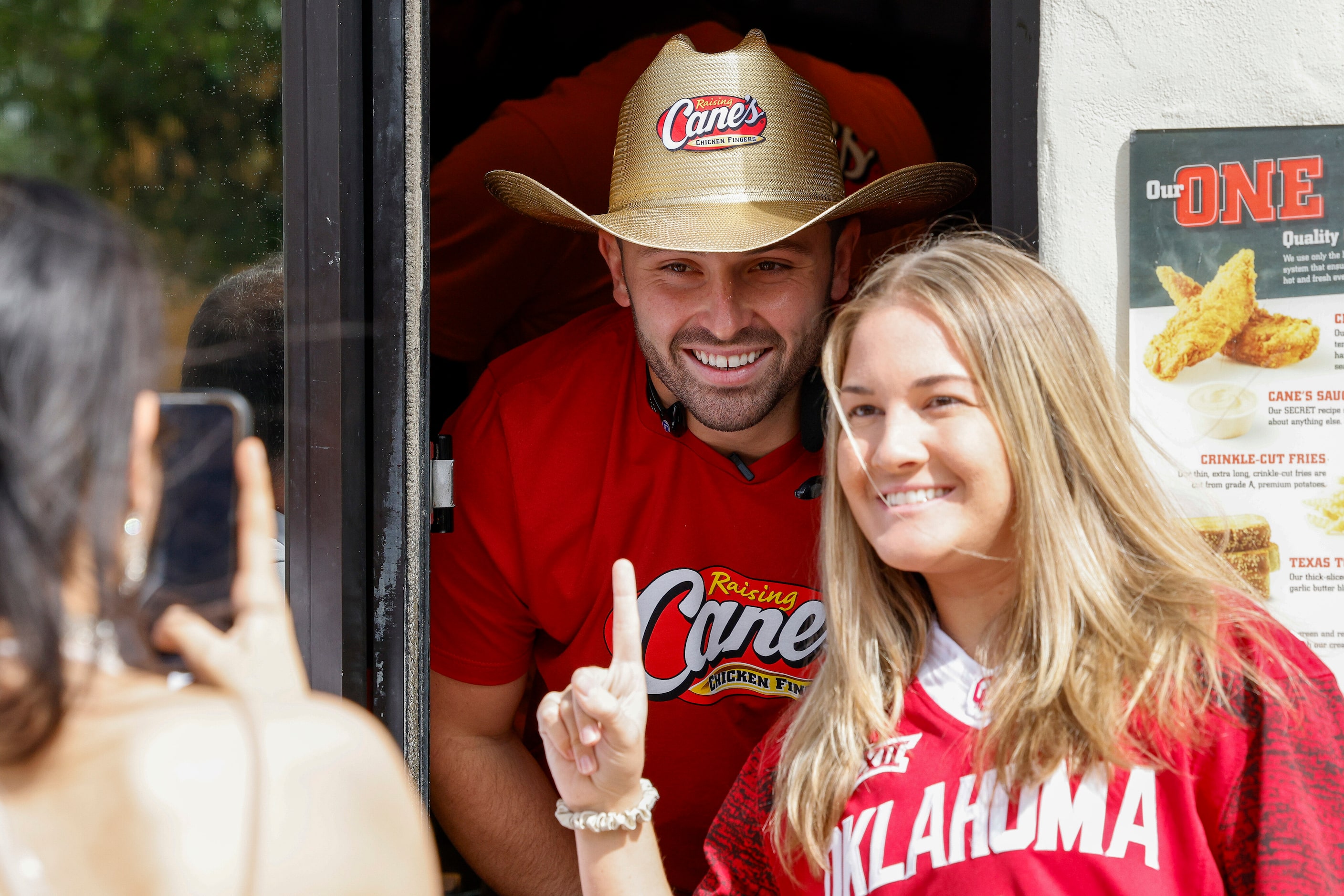 Former Oklahoma quarterback Baker Mayfield poses for a photo with Rachel Williams as he...