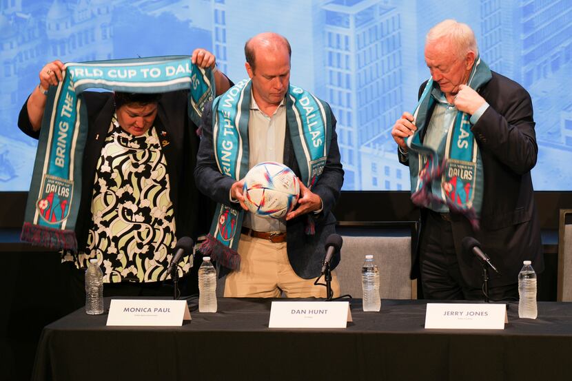 Monica Paul (from left), Dan Hunt and Jerry Jones don Dallas World Cup scarves during a...