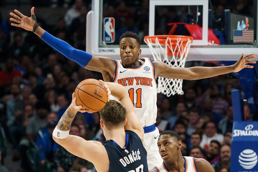 New York Knicks guard Frank Ntilikina (11) defends against Dallas Mavericks guard Luka...