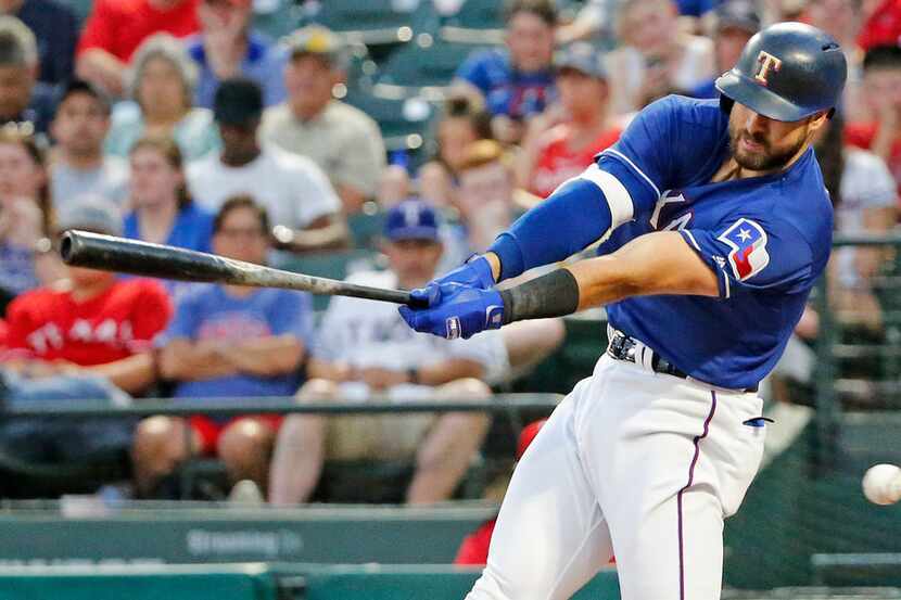 Texas Rangers left fielder Joey Gallo (13) swings and misses in the fourth inning during the...