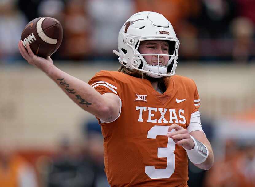 FILE - Texas quarterback Quinn Ewers looks to pass against Baylor during the first half of...