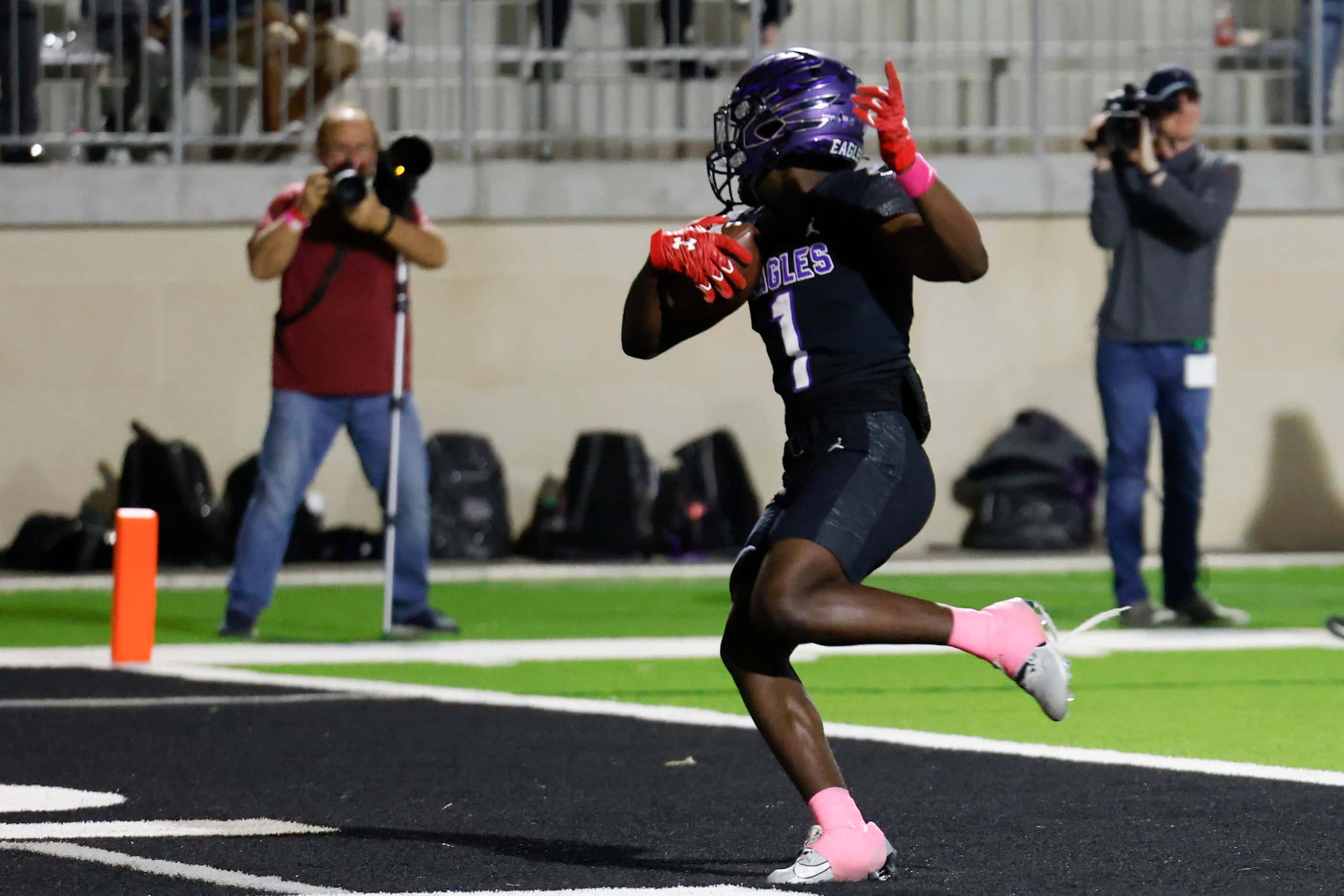 Crowley High’s Antayvious Ellis celebrates a touchdown against Trinity High during the first...