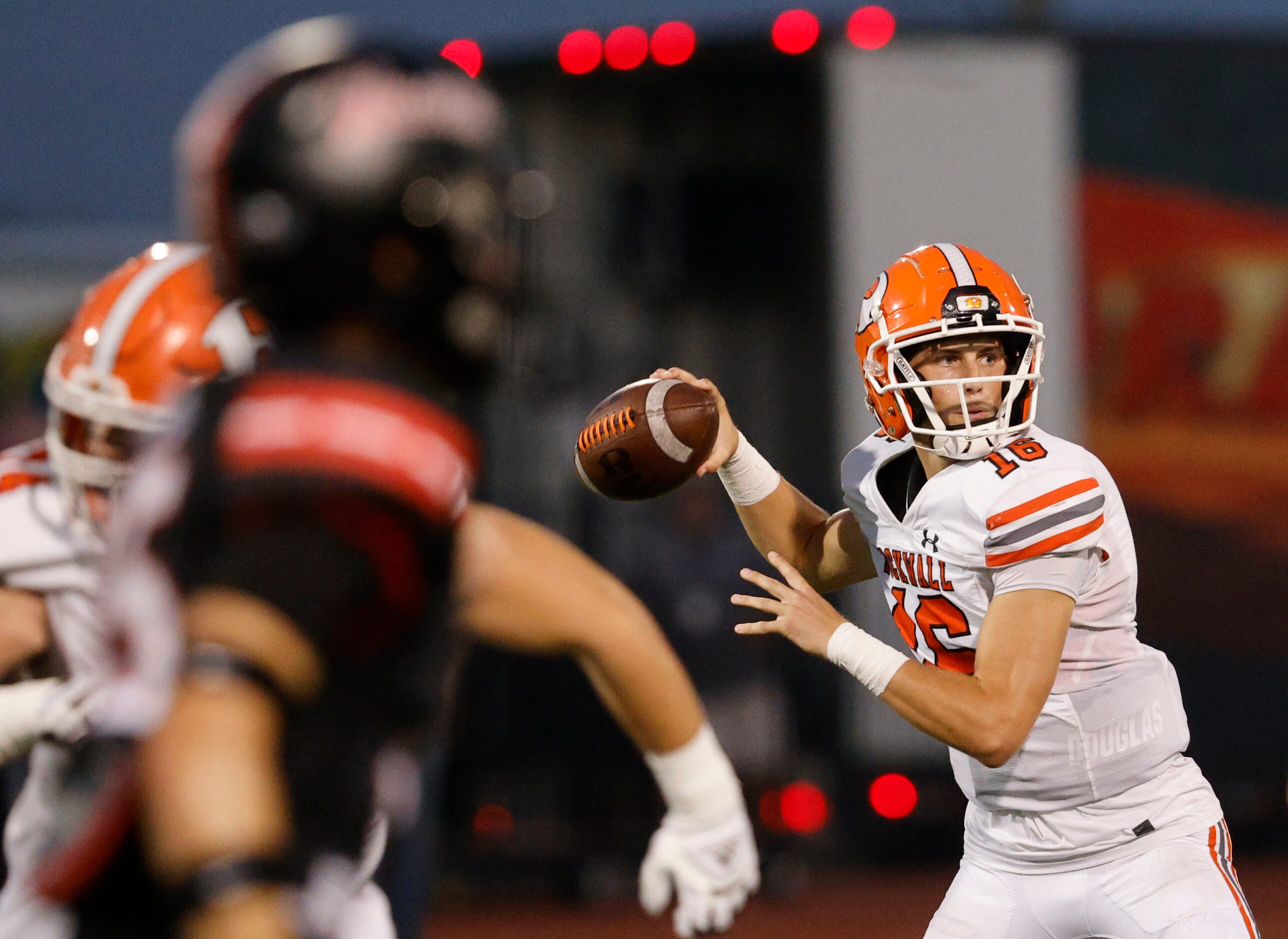 Rockwall's quarterback Mason Marshall (16) looks to throw the ball against Rockwall-Heath...