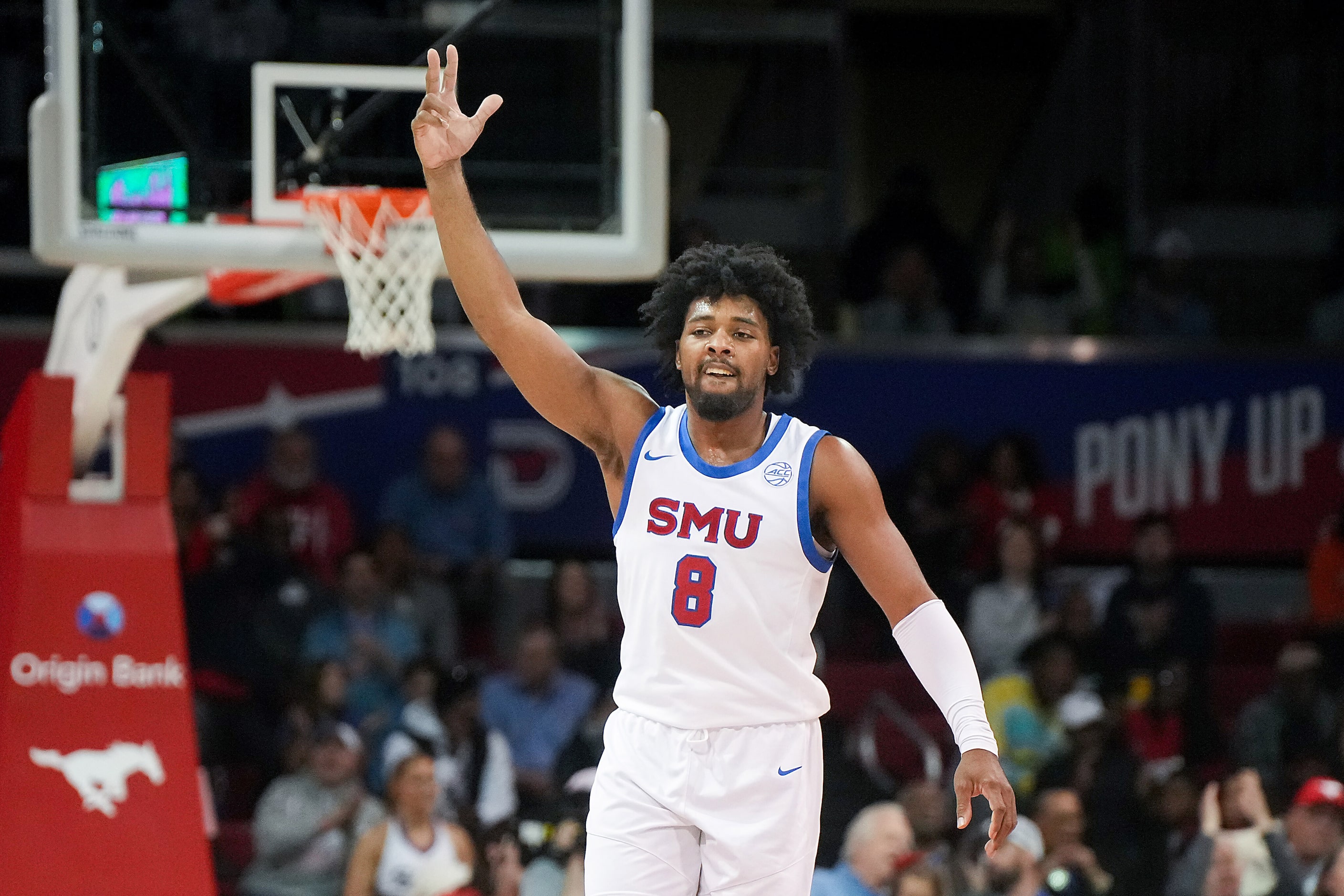 SMU guard Kario Oquendo celebrates after a basket during the first half of an NCAA men’s...