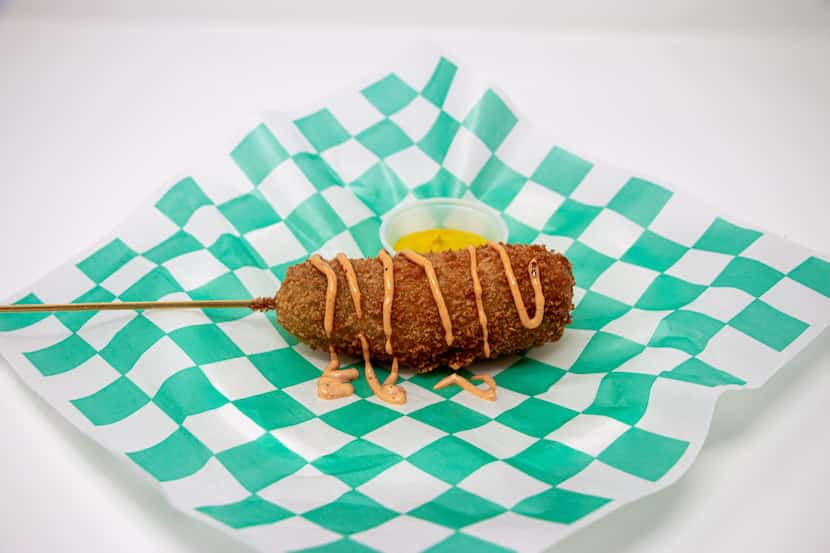 The Crispy Dilly Dog is a deep-fried whole pickle with a beef hot dog stuck through the...