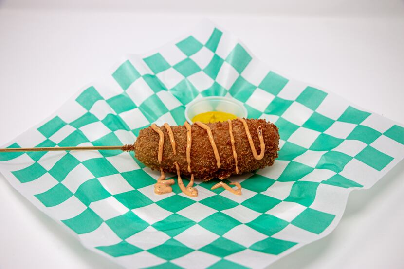 The Crispy Dilly Dog is a deep-fried whole pickle with a beef hot dog stuck through the...