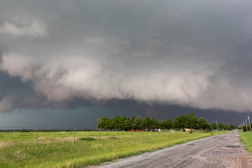 FILE - In this May 31, 2013 file photo, a tornado forms near Banner Road and Praire Circle...