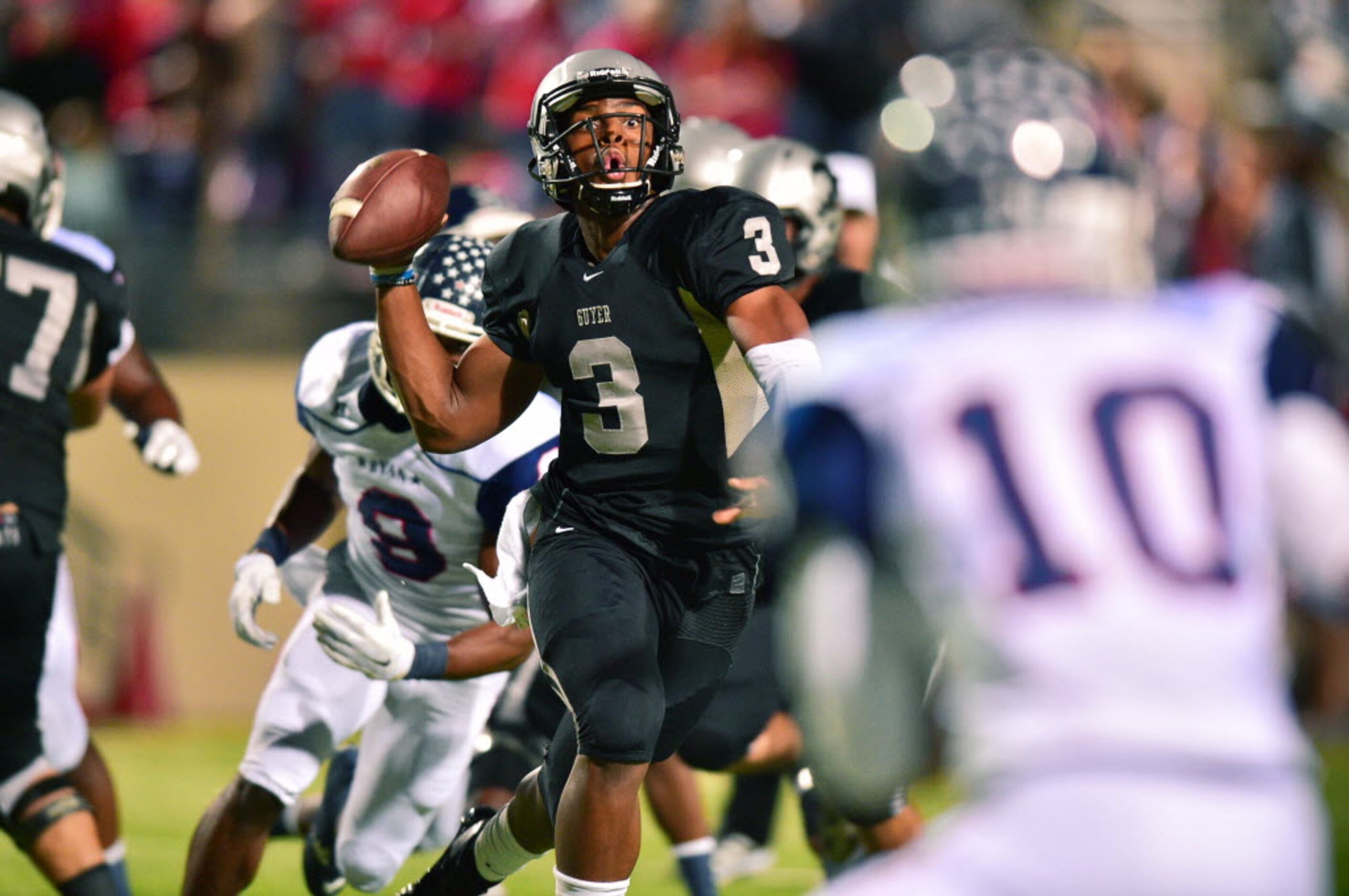 Guyer junior quarterback Shawn Robinson (3) throws on the run against Ryan, Friday, November...