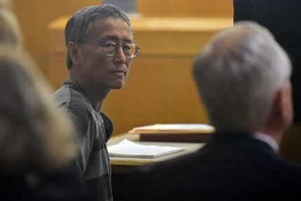 George Guo glances back during a hearing Aug. 2.