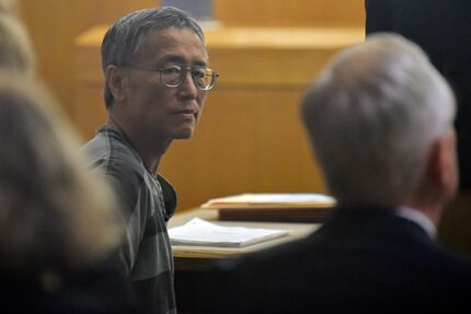 George Guo glances back during a hearing Aug. 2.