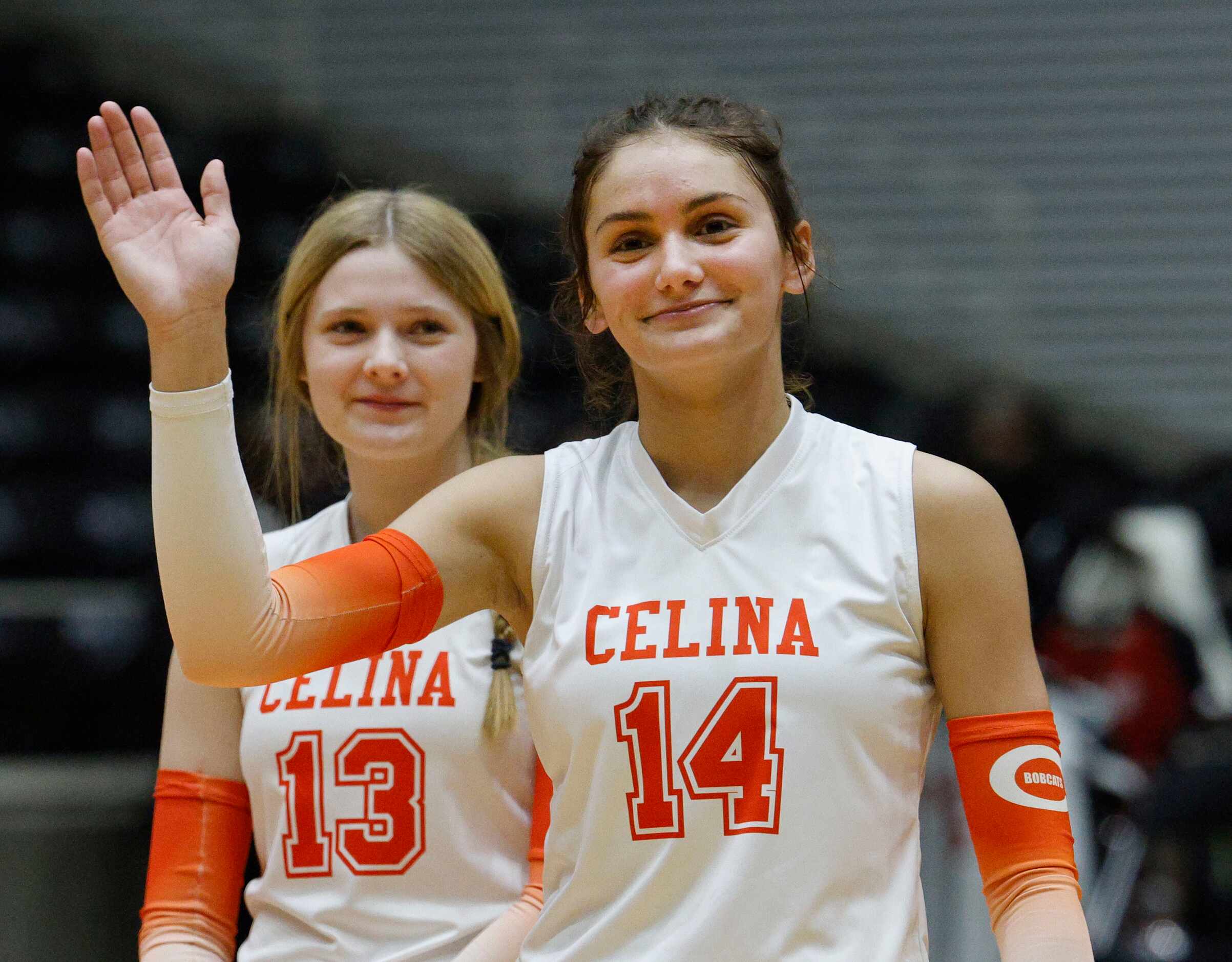 Celina's Kennedy Hangartner (14) waves during an introduction of the players at a UIL class...
