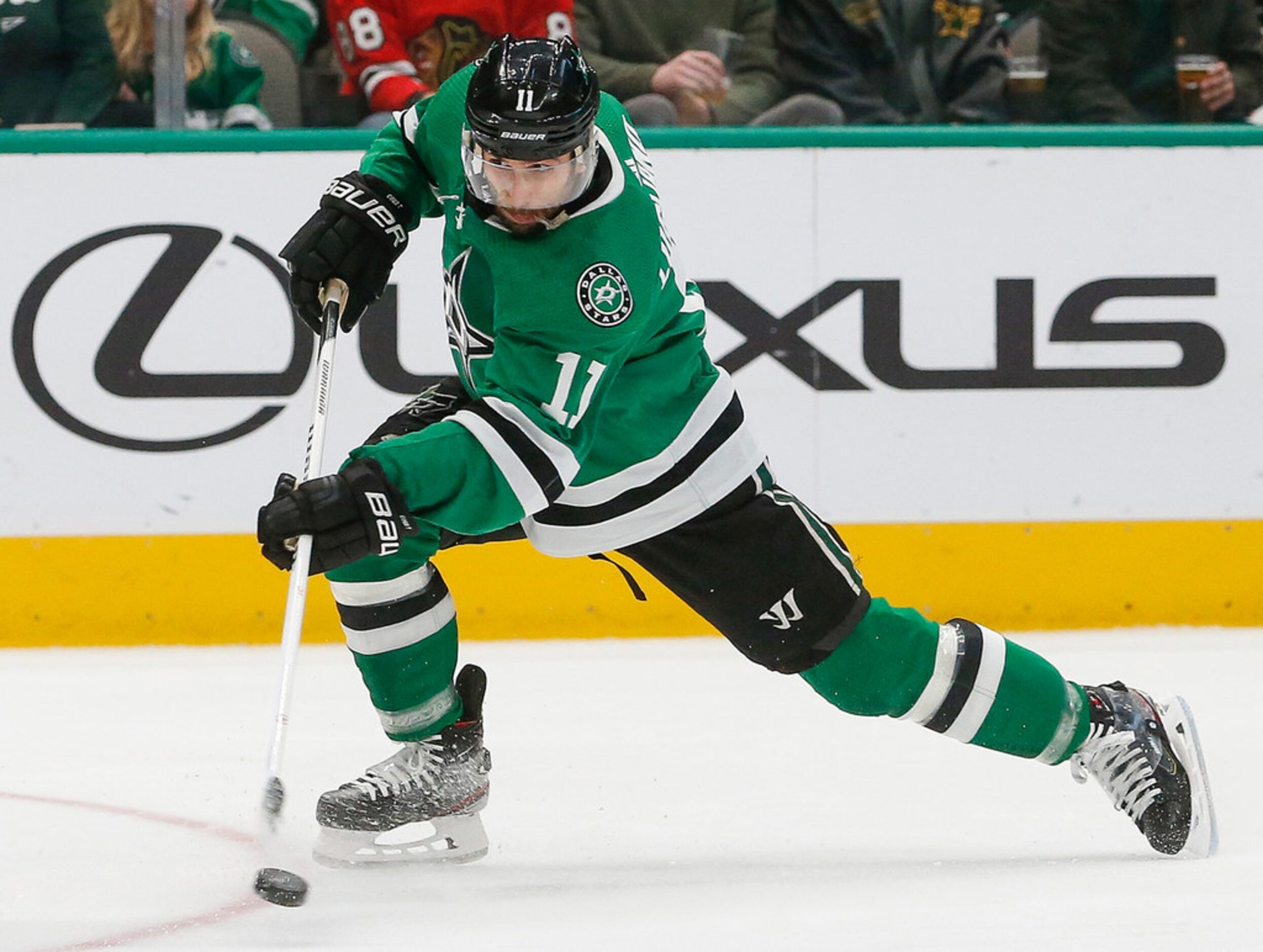 Dallas Stars center Andrew Cogliano (11) takes a shot during the first period against the...