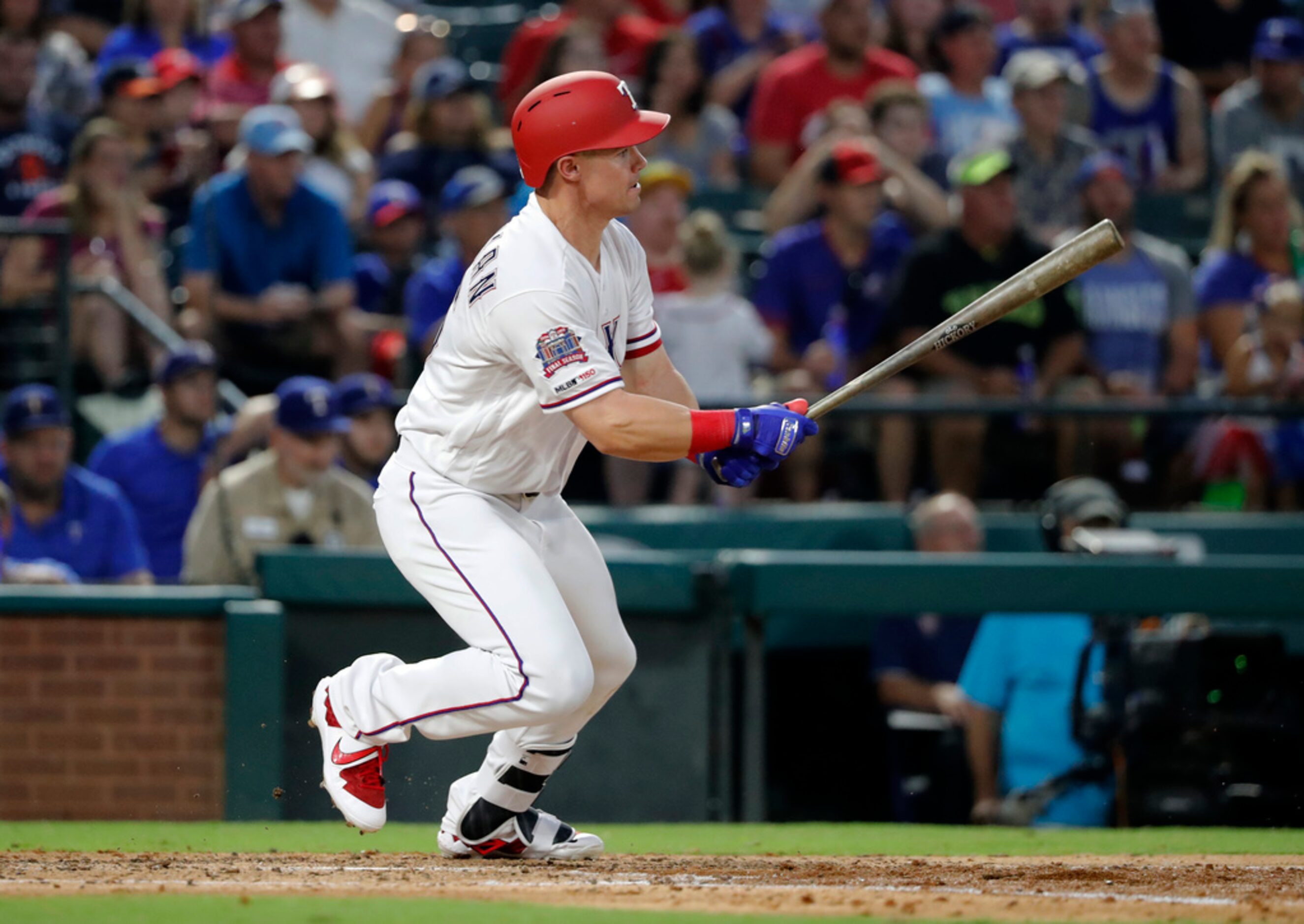 Texas Rangers' Scott Heineman follows through on a fielders choice in the fourth inning of a...