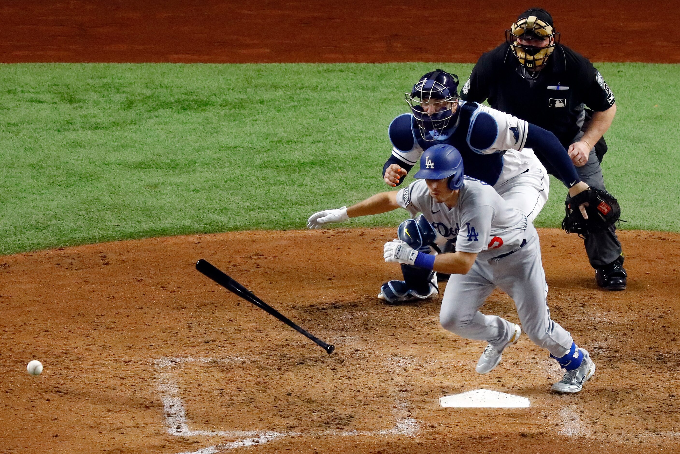 Los Angeles Dodgers catcher Austin Barnes (15) lays down a sacrifice bunt during the fourth...