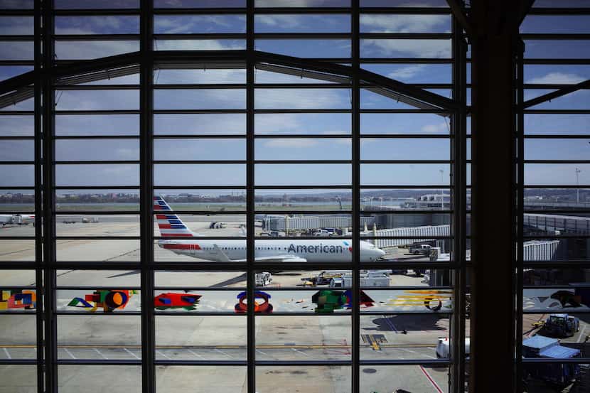 (FILES) In this file photo taken on March 17, 2020 an American Airlines plane is seen from a...