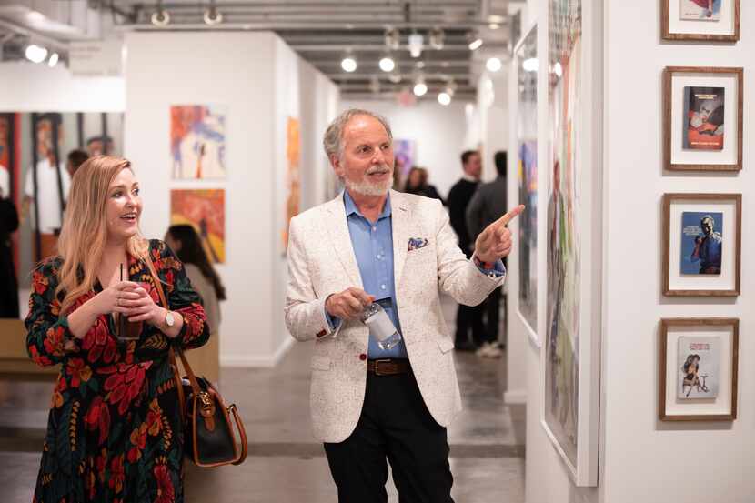 Art lovers Chelsi Blackman and Warren Ernst browsed the exhibit space during opening night...