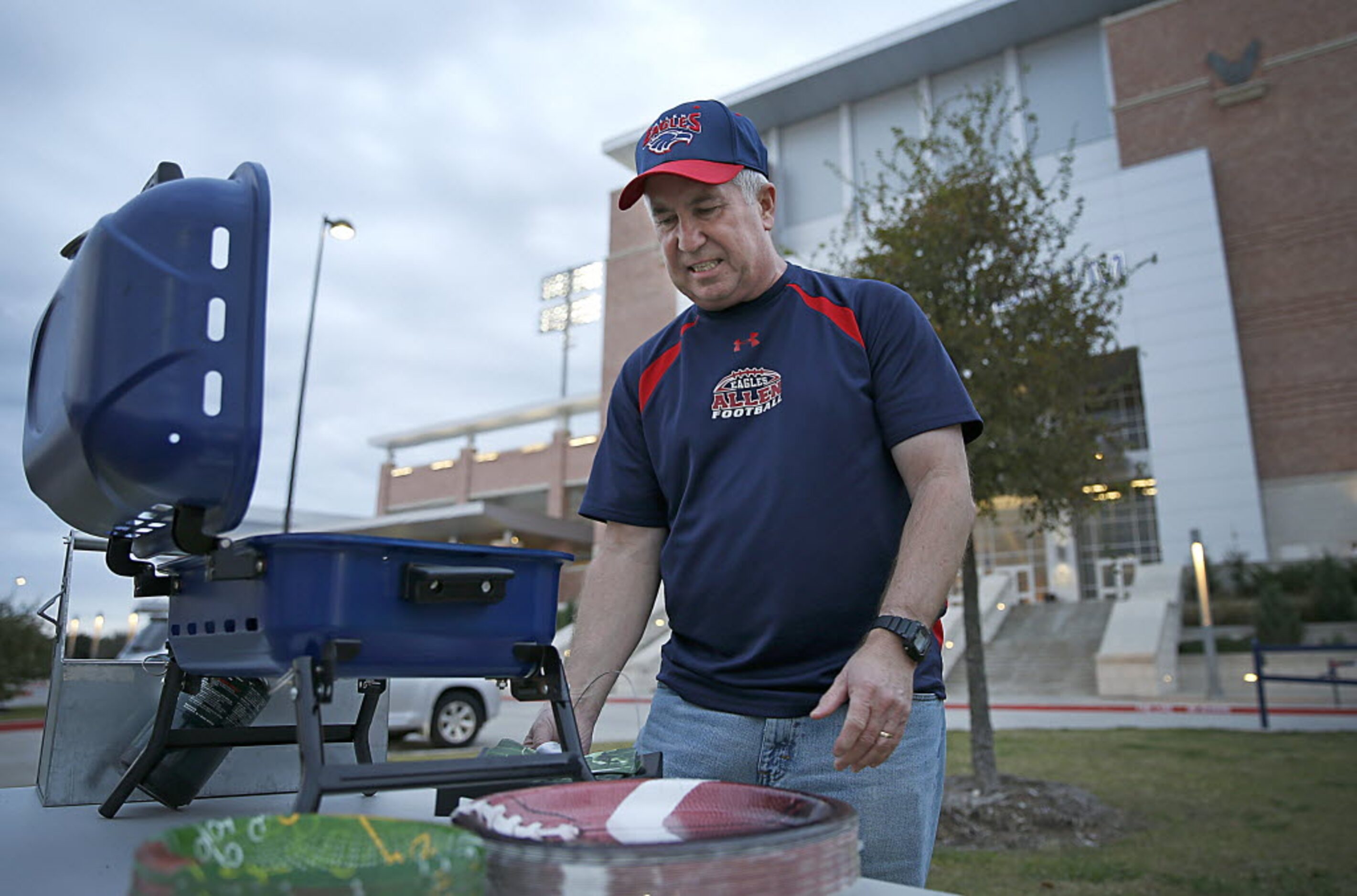 Allen football fan Sam Green gets ready for tailgating prior to the Plano East game at Eagle...