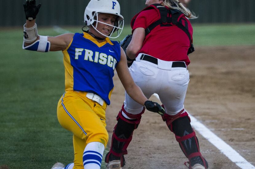 Frisco's Valerie Bennett (5) slides past Mansfield Legacy's Reagan Wright (20) to score a...
